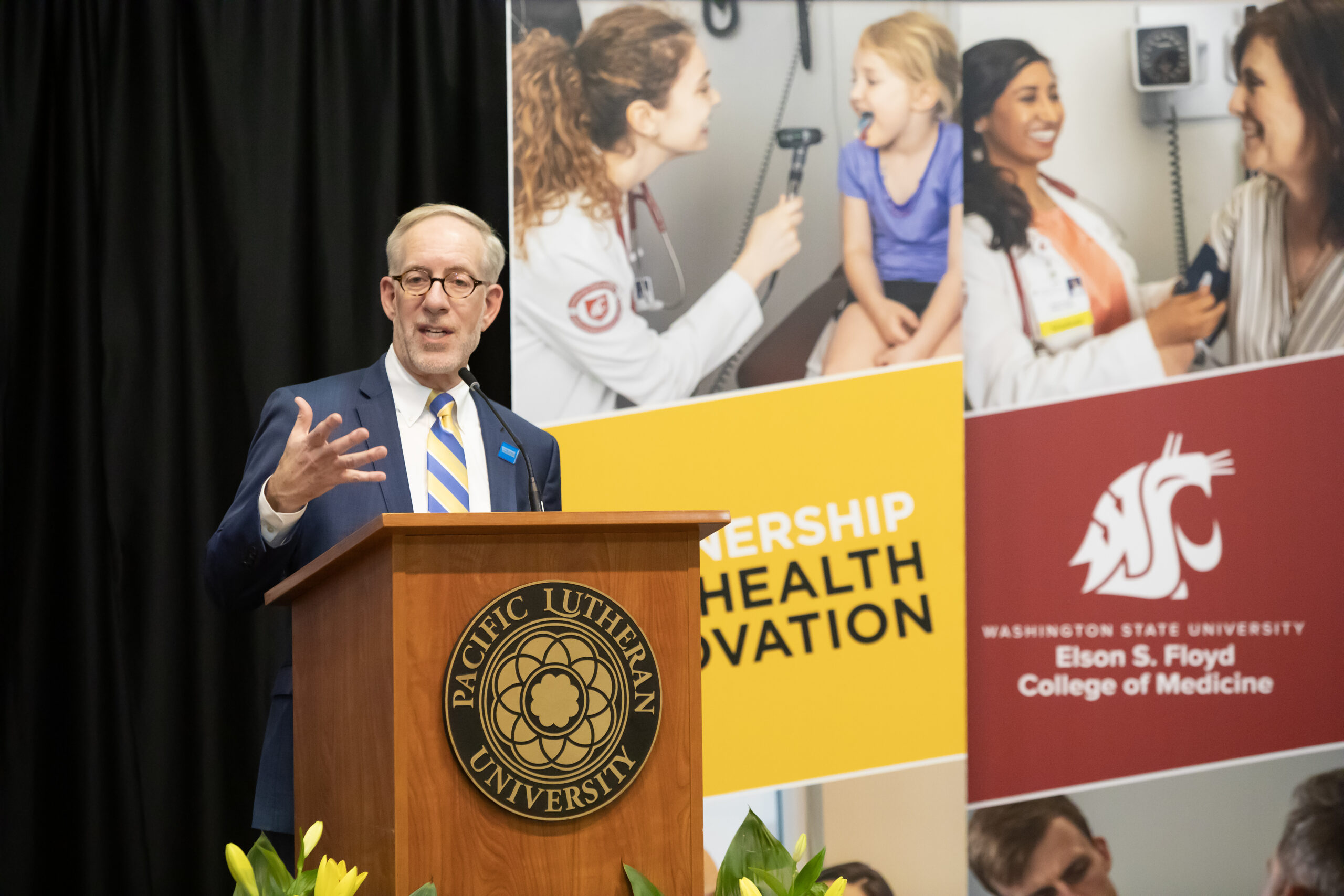 MultiCare CEO Bill Robertson speaks at the announcement of the new partnership between MultiCare Health Systems, Washington State University Elson S. Floyd College of Medicine, and Pacific Lutheran University, Tuesday, Feb. 6, 2024, at PLU. (PLU Photo / Sy Bean)